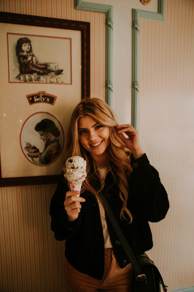 A happy girl with an ice cream smiling